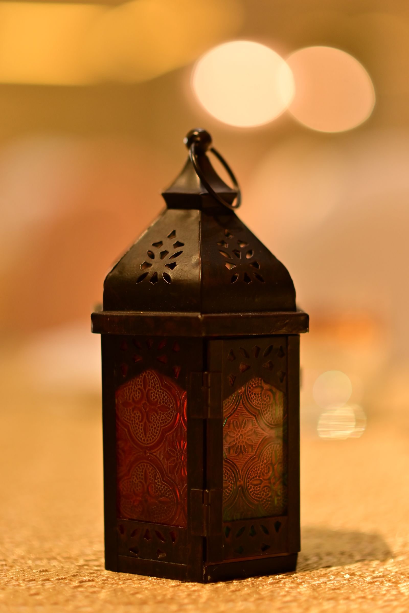 Ornate Arabian Ramadan lantern glowing with warm golden light in a luxury Dubai interior