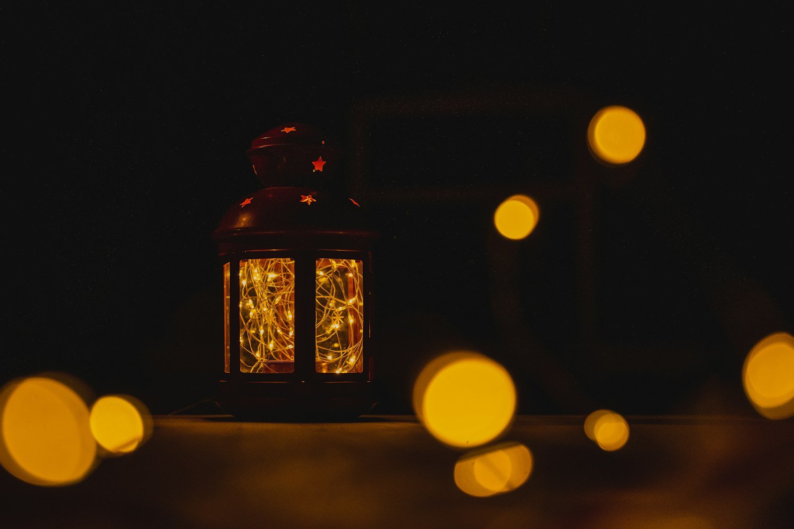 Ramadan catering Dubai lantern glowing with warm fairy lights